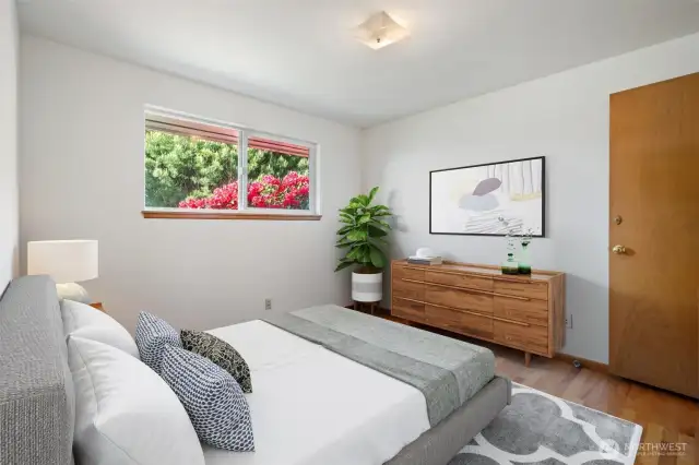 2nd Bedroom off main hallway - virtually staged to show you the space. Original hardwood floors.