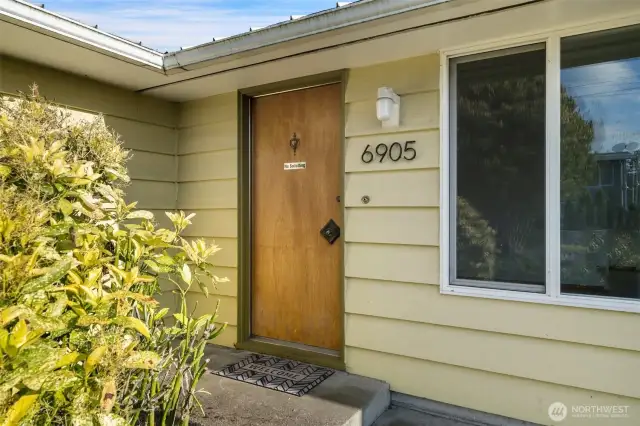 Entry to level in living, dining with 3 bedrooms & 2 baths