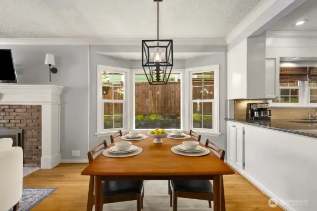 Enjoy a seat at the table while keeping an eye on loved ones as they play or relax in the private backyard.