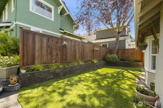 Flex your green thumb in the low-maintenance yard—complete with raised beds and a built-in sprinkler system to make gardening a breeze.