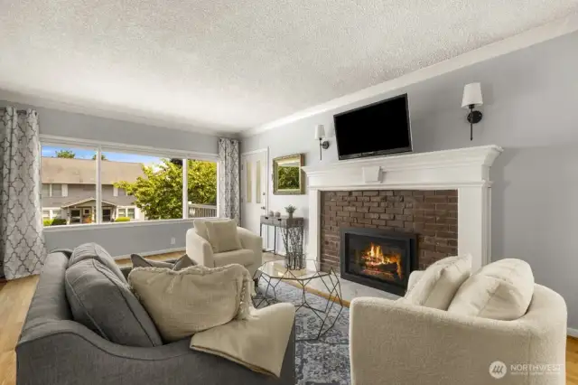 A stunning gas fireplace with a classic mantel anchors the living space—adding warmth, charm, and just the right touch of vintage character.