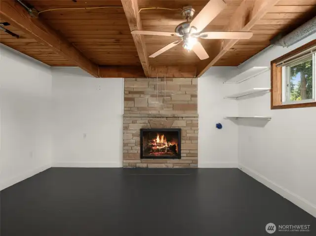 Lower Level Living Area with Wood Burning Fireplace, Would Make a Great Home Office!