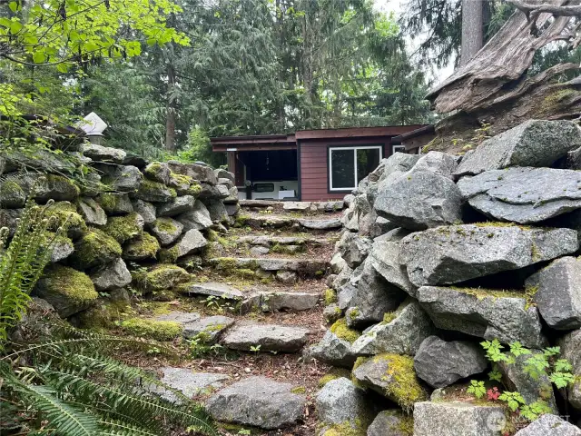 Beautiful rock staircase going to the community forest