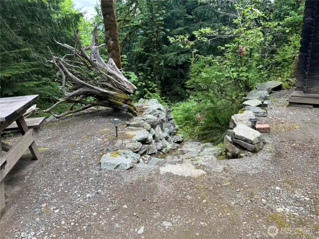 Rock stairway going to wooded area.