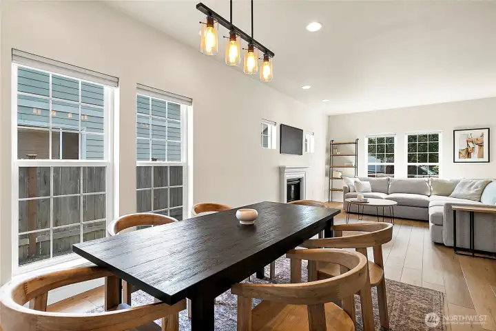 Spacious dining/living room combo offers a seamless flow and a beautiful focal point with views to the fireplace.