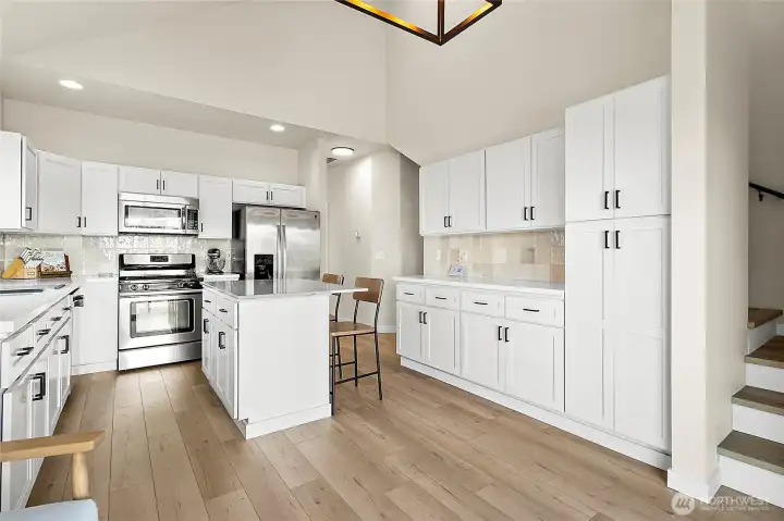 With stainless steel appliances, abundant storage, and an eat-in area, the kitchen is as functional as it is beautiful—perfect for both everyday meals and entertaining.