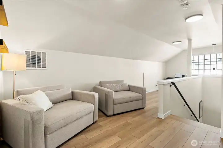 Upstairs bonus room offers endless possibilities—entertain, work, or relax in style.