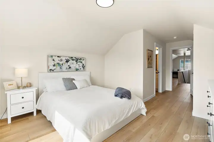 Upstairs bedroom and full bath provide comfort and privacy—an ideal space for overnight visitors.