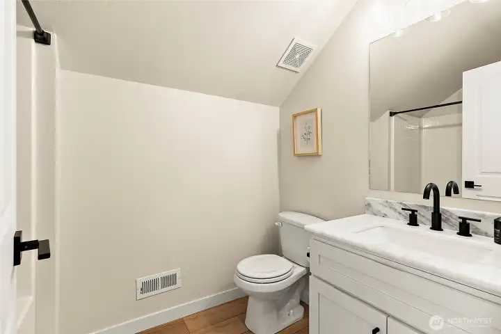 Updates to the upstairs bath include, new sink, counter, faucet and hardware.