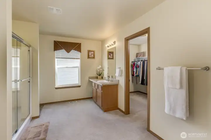 Plenty of space to relax in the Primary bathroom plus a large walk-in closet with a window.