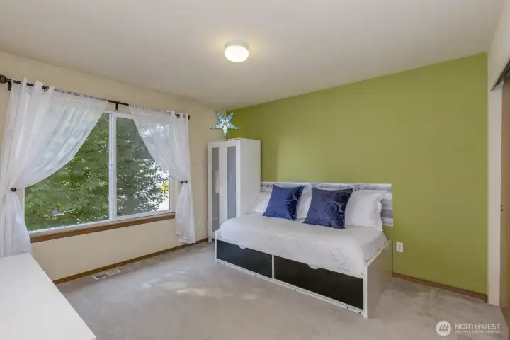 1 of 3 upper bedrooms.  This one with a peaceful garden view.