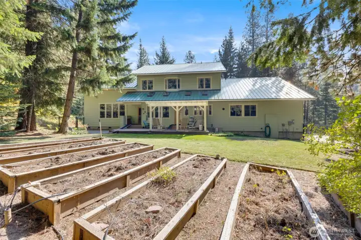 Raised garden bed are protected inside the fenced in area