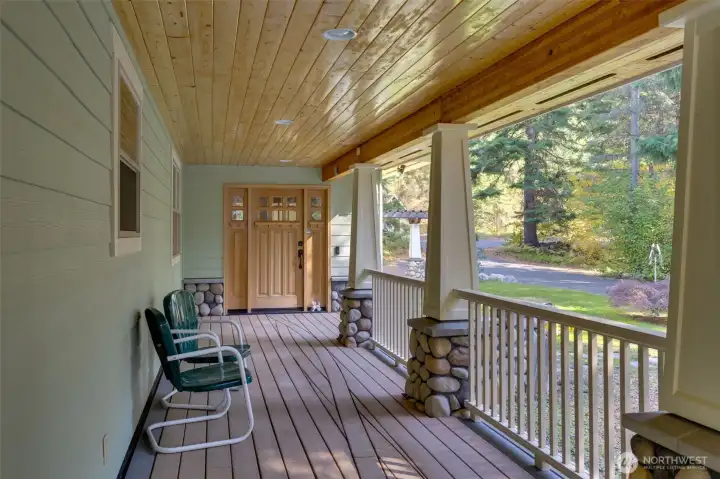 Covered front deck/ porch area. Perfect for sipping your morning coffee & watching the wildlife