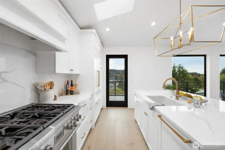 Kitchen with propane stove top.