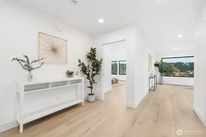 2nd level down.  Primary bedroom and den (or bonus room).  Both with views.