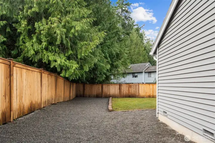 This flexible side yard is the perfect canvas, ready for a dog run, raised flower beds, or whatever outdoor vision you imagine.