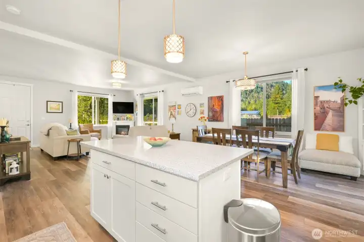 The kitchen has beautiful quartz countertops and this center island that provides extra storage and lots of counter space.