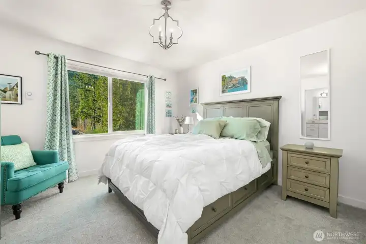 Primary Bedroom with a window that provides a beautiful view of the mountains.