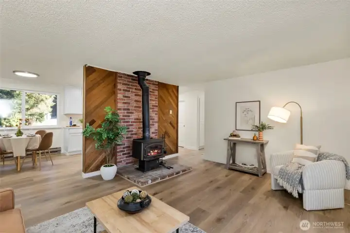Cozy wood burning fireplace highlighted by a cedar accent wall in the large living room!