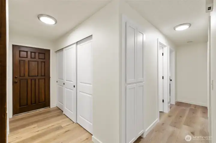 Oversized entry closet and around the corner built-in linen closet!