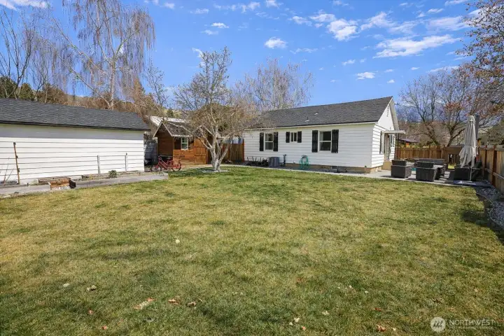 Backyard with storage shed and detached garage