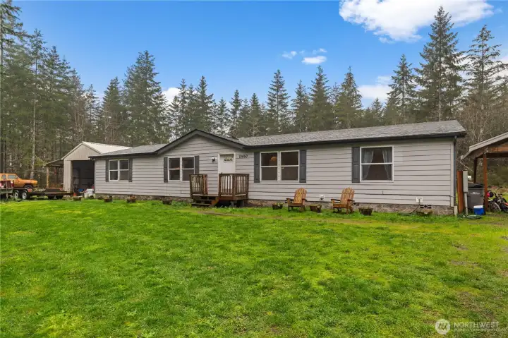 Newer roof, carport to the right, storage shed on the left. This is the perfect home for country living yet only 15 minutes to Costco.