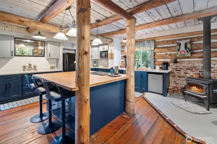 Updated kitchen with another wood stove and so much cabinet storage