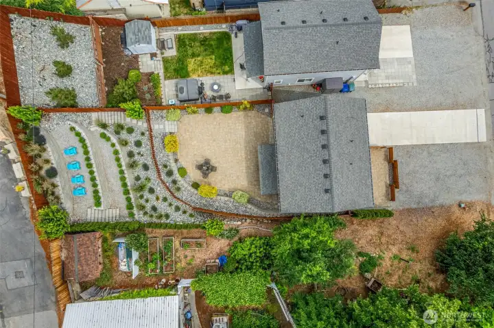 Aerial view showcases exceptional outdoor amenities, generous parking, and meticulously maintained grounds.