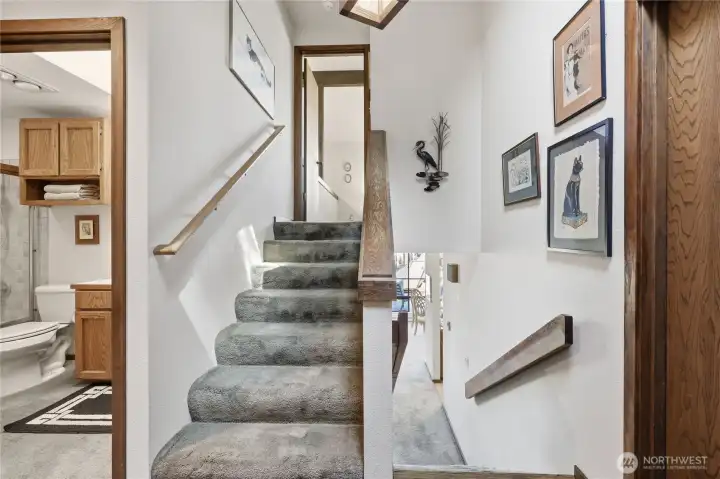 Stairs from the entry level to the primary suite