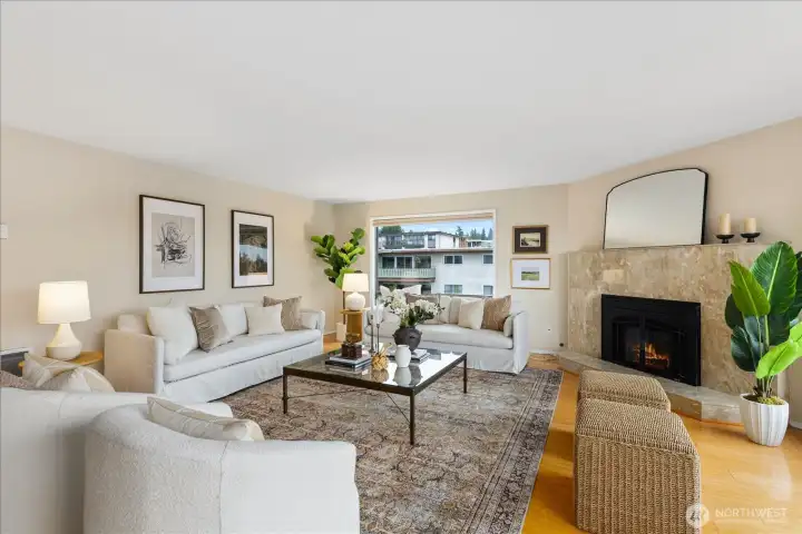 Anchored by a marble-faced gas fireplace . .