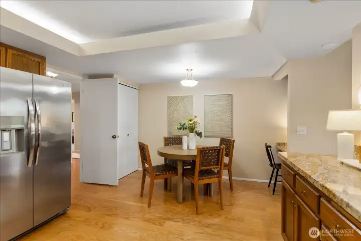 Informal dining space is rarely found in a condo   . . .