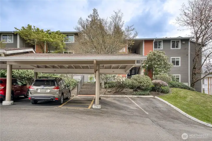 This is the first building on the right as you come up the Eastern driveway. Covered carport comes with unit.
