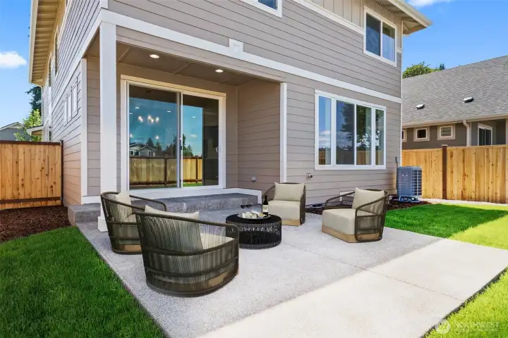 Covered outdoor patio with fully fenced and lanscaped setting