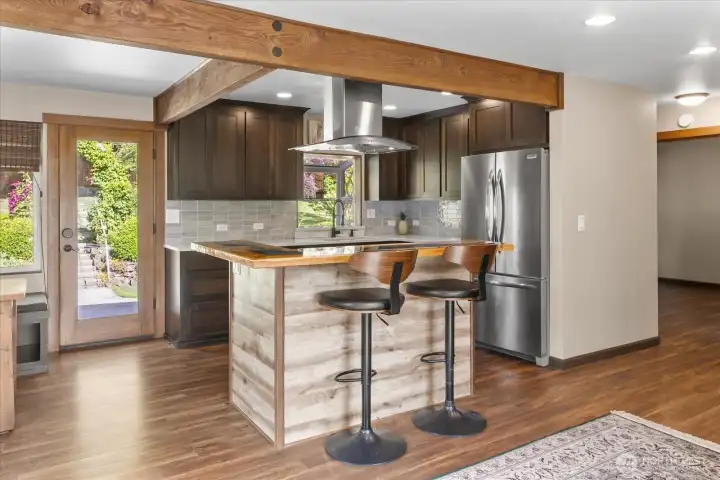 Modern kitchen with a bar-height island. Modern kitchen with a bar-height island.