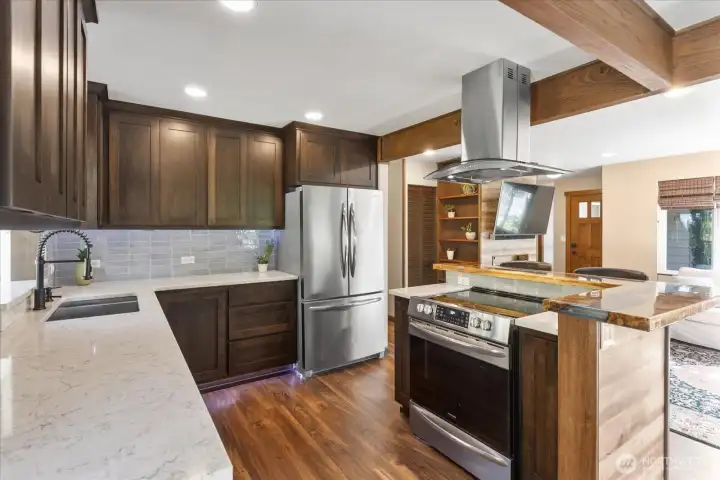 Newly remodeled in 2020, this kitchen includes custom soft-close cabinets, engineered quartz countertops, and stainless steel appliances. Newly remodeled in 2020, this kitchen includes custom soft-close cabinets, engineered quartz countertops, and stainless steel appliances.