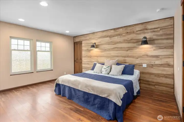 Primary bedroom including a convenient pocket door leading to the walk-in closet. Primary bedroom including a convenient pocket door leading to the walk-in closet.