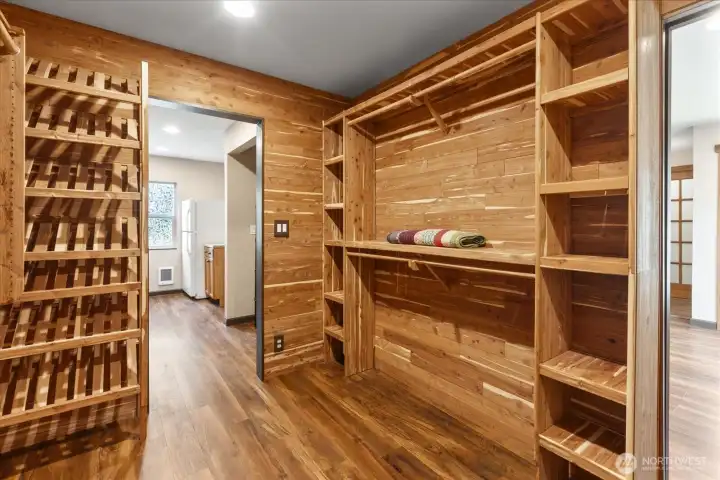 Cedar-lined walk-in closet featuring built-in shoe racks and ample storage cubbies. Cedar-lined walk-in closet featuring built-in shoe racks and ample storage cubbies.