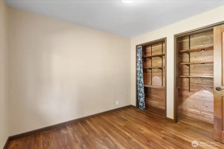 Second bedroom featuring a custom cedar-lined closet. Second bedroom featuring a custom cedar-lined closet.