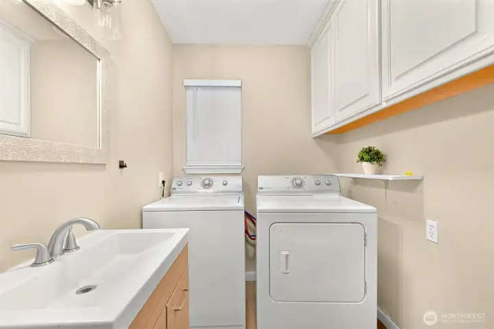 Function meets style! ??? This combined laundry and powder room is designed for convenience and modern living.