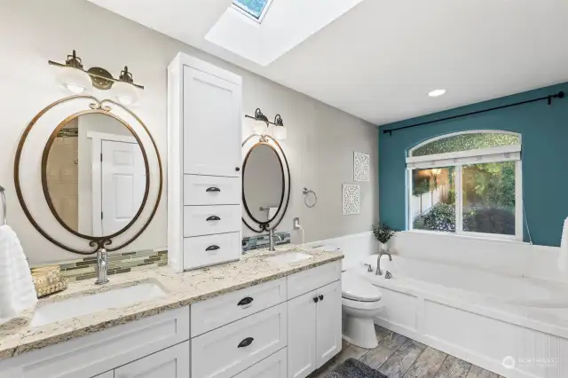 A primary bathroom that does not disappoint! Soaking tub, double vanity w/ extra storage