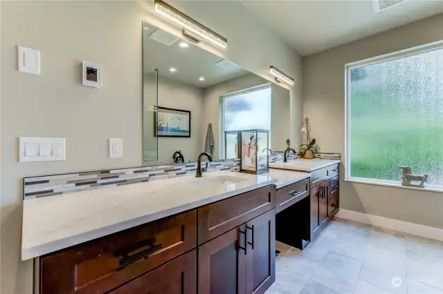 Double Sinks and lots of counter space in the elegant Primary Ensuite.