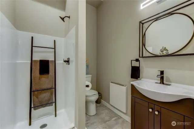 Lower Level 3/4 bathroom features recirculating hot water.