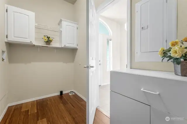 Laundry room with hardwood floors