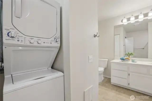 Primary Bathroom with stackable w/d and newer water heater.