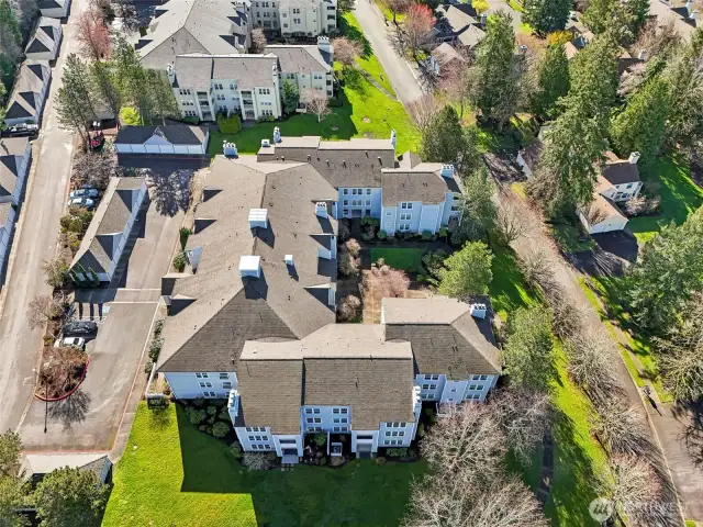 Garages are detached.  U-shaped mid-rise with courtyard for all to enjoy