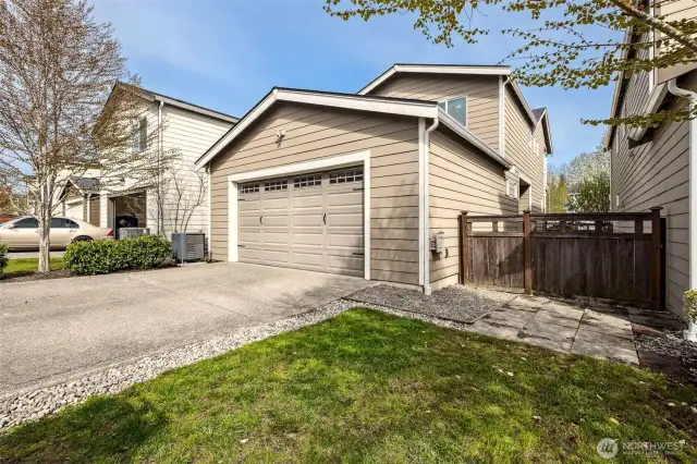 Alley access garage & parking pad, plus small yard space