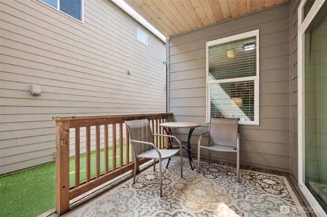 Side yard, 10-12 feet between houses, for exclusive use, includes this great covered area plus turf lawn