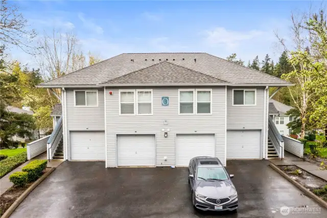 This well-maintained building features a clean, contemporary exterior with attached garages and private staircases for each unit—offering the feel of a standalone townhome. Unit entrances are set apart, enhancing privacy and convenience. Enjoy the benefit of direct garage access, ample guest parking, and a quiet, tree-lined setting in a professionally managed community. This is low-maintenance living at its best, just minutes from shopping, dining, parks, and commuter routes in the heart of Federal Way.