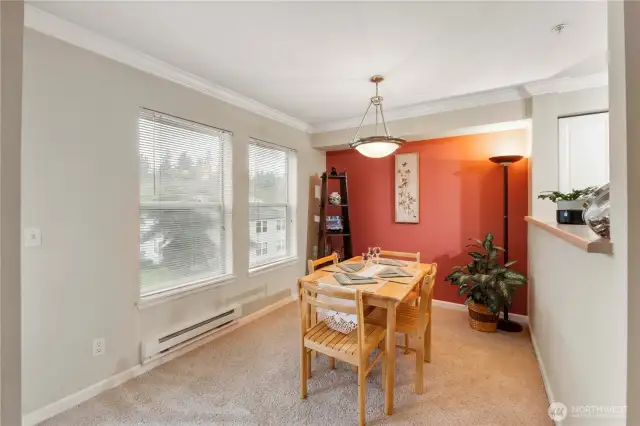 Whether hosting a dinner party or enjoying a quiet meal, this dining room offers a tranquil retreat with a backdrop of lush trees and landscaped grounds just outside. The neutral palette and clean lines make it a versatile setting to suit any décor style.