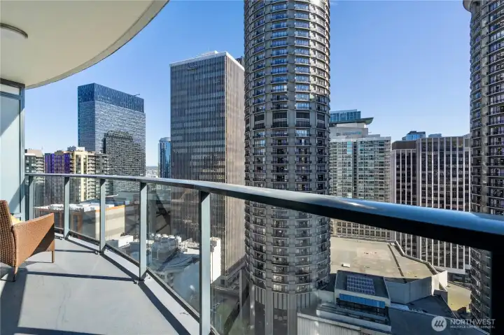 Expansive balcony with stunning views of the city skylined.